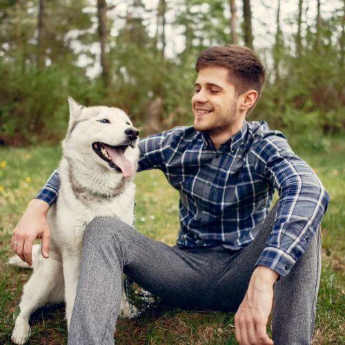 up-handsome-guy-in-a-summer-park-with-a-dog-2023-11-27-05-31-48-utc.jpg